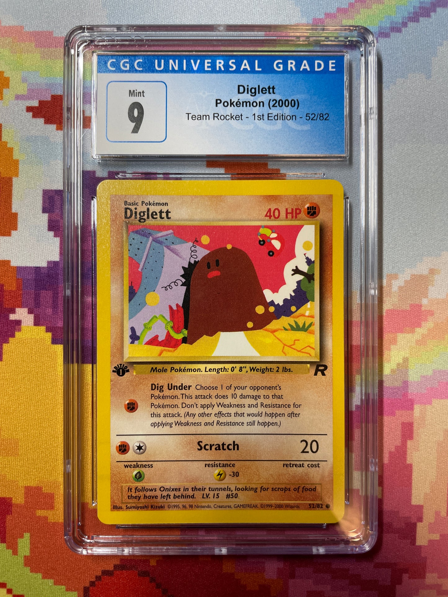 2000 Pokémon Team Rocket 1st Edition Diglett 52/82 CGC 9 Mint
