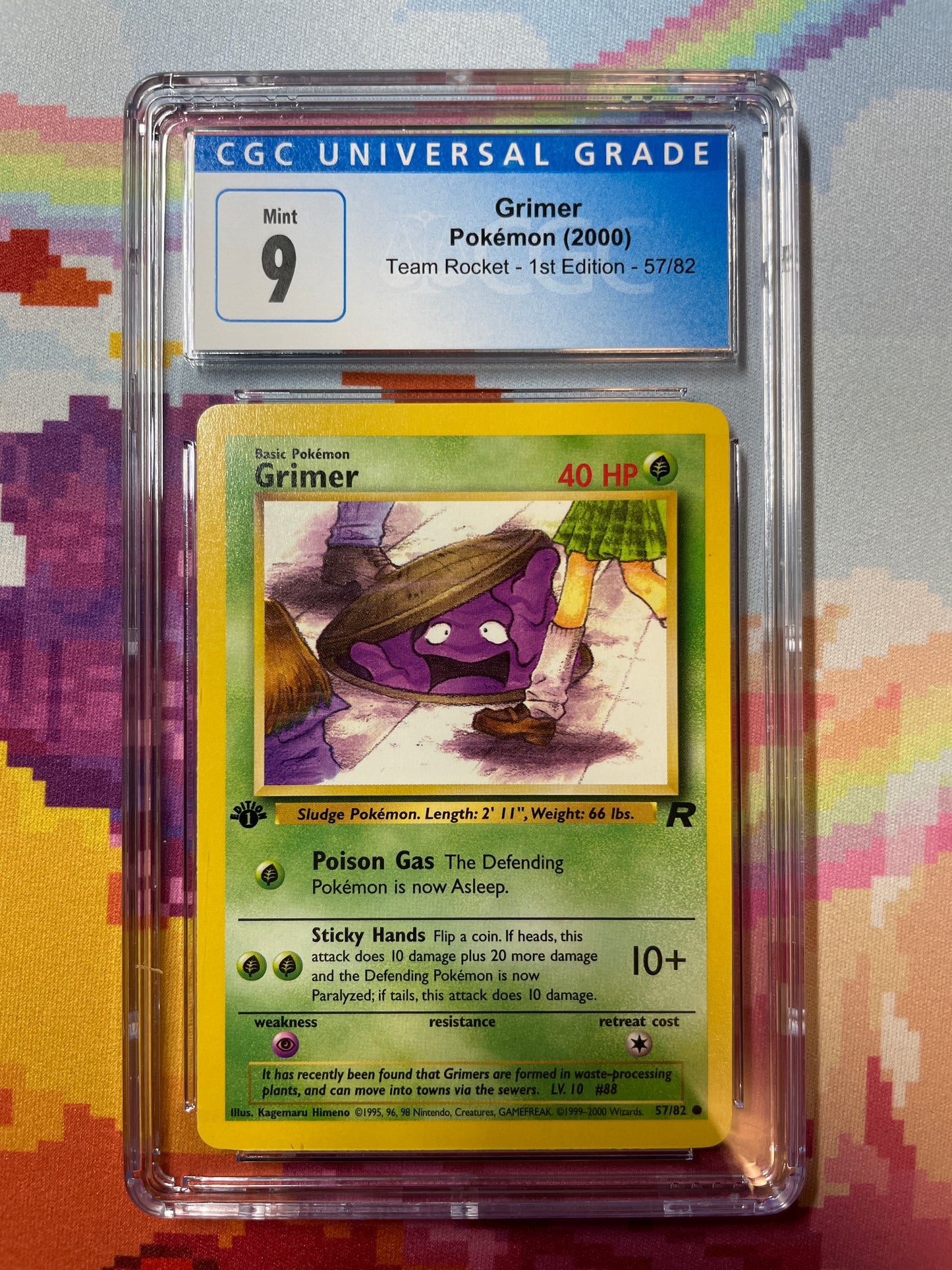 2000 Pokémon Team Rocket 1st Edition Grimer 57/82 CGC 9 Mint