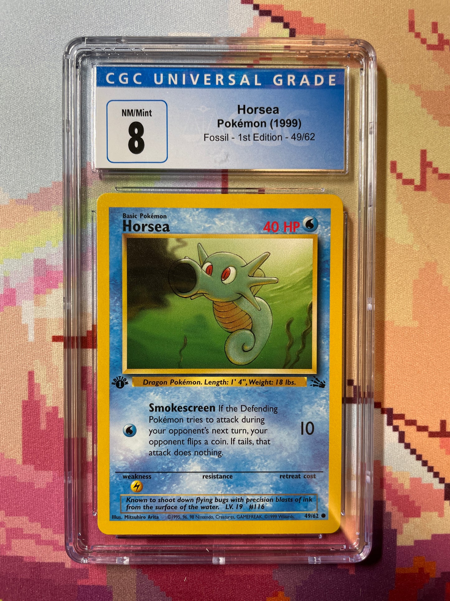 1999 Pokémon Fossil 1st Edition Horsea 49/62 CGC 8 NM/Mint